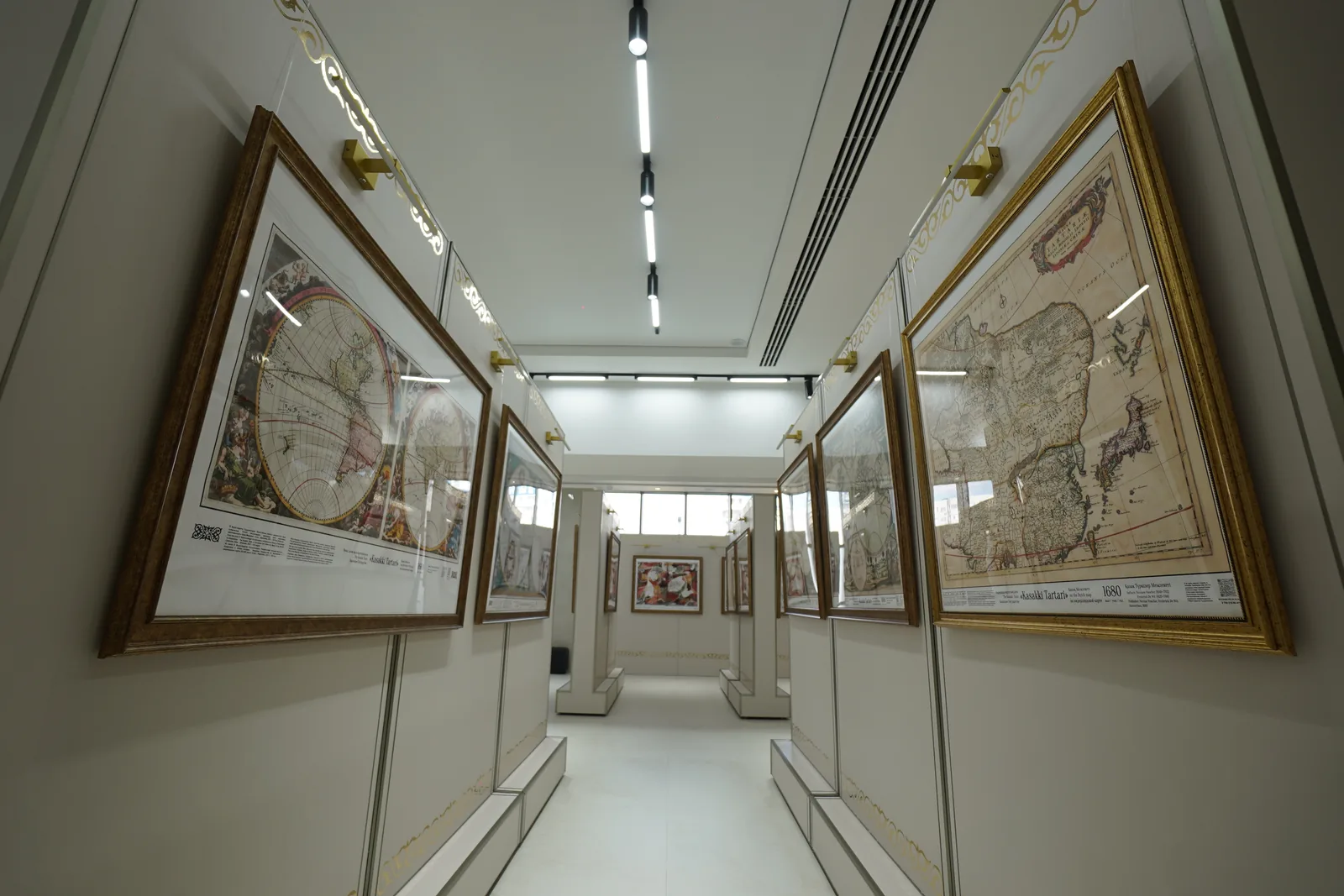 Antique maps in exhibition frames